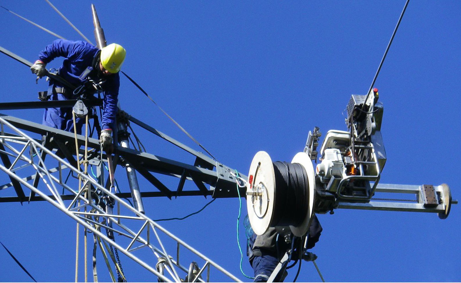 Aerial fibre optic cable installation on telecommunications tower
